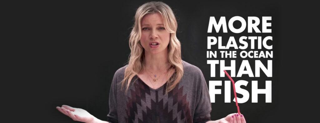 Still of actress Amy Smart holding a red straw as part of the Stop Sucking campaign to encourage the use of alternatives to plastic straws